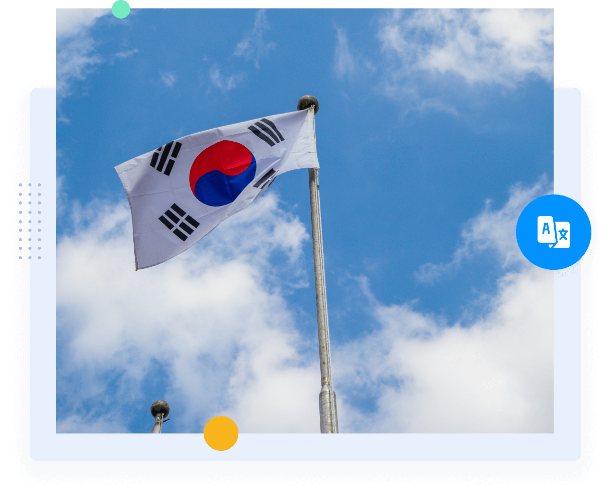 South Korean flag on a flag pole flying with the sky in the background.